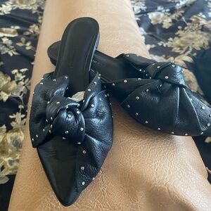 Like new black flats with leather bow and studs